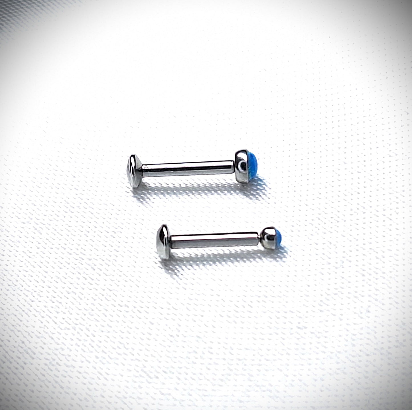 Push in Flat Backed stud with BLUE 2mm or 3mm Opal stone. 5mm, 6mm, 7mm, 8mm, 9mm, 10mm, 11mm, 12mm, 20ga, 18ga, 16ga