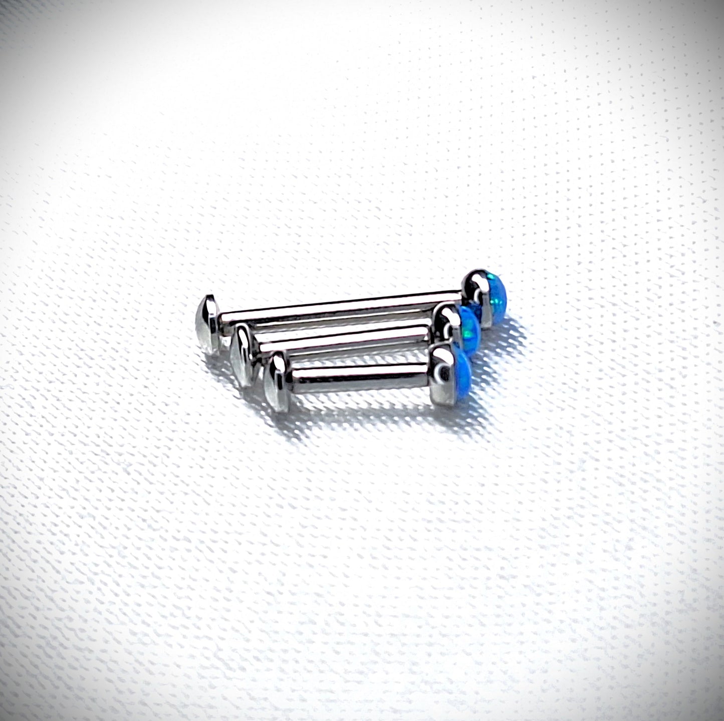 Push in Flat Backed stud with BLUE 2mm or 3mm Opal stone. 5mm, 6mm, 7mm, 8mm, 9mm, 10mm, 11mm, 12mm, 20ga, 18ga, 16ga