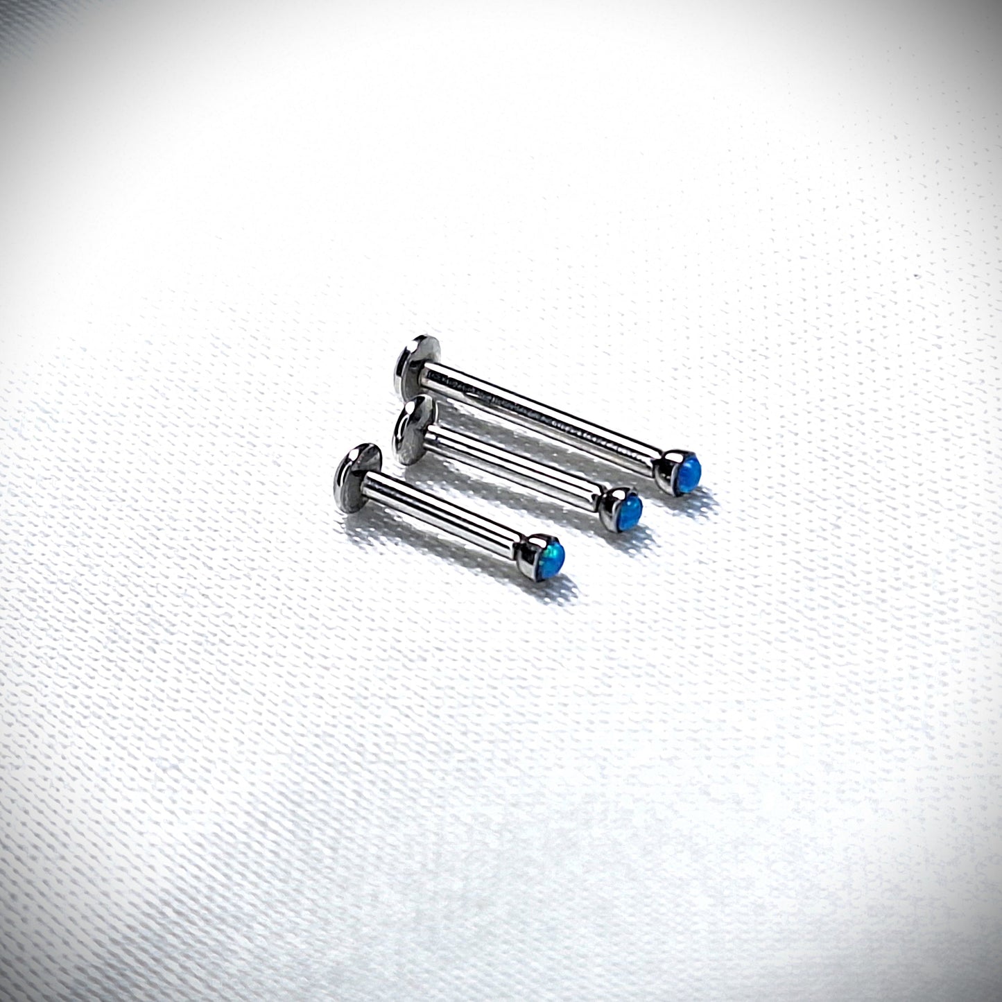 Push in Flat Backed stud with BLUE 2mm or 3mm Opal stone. 5mm, 6mm, 7mm, 8mm, 9mm, 10mm, 11mm, 12mm, 20ga, 18ga, 16ga