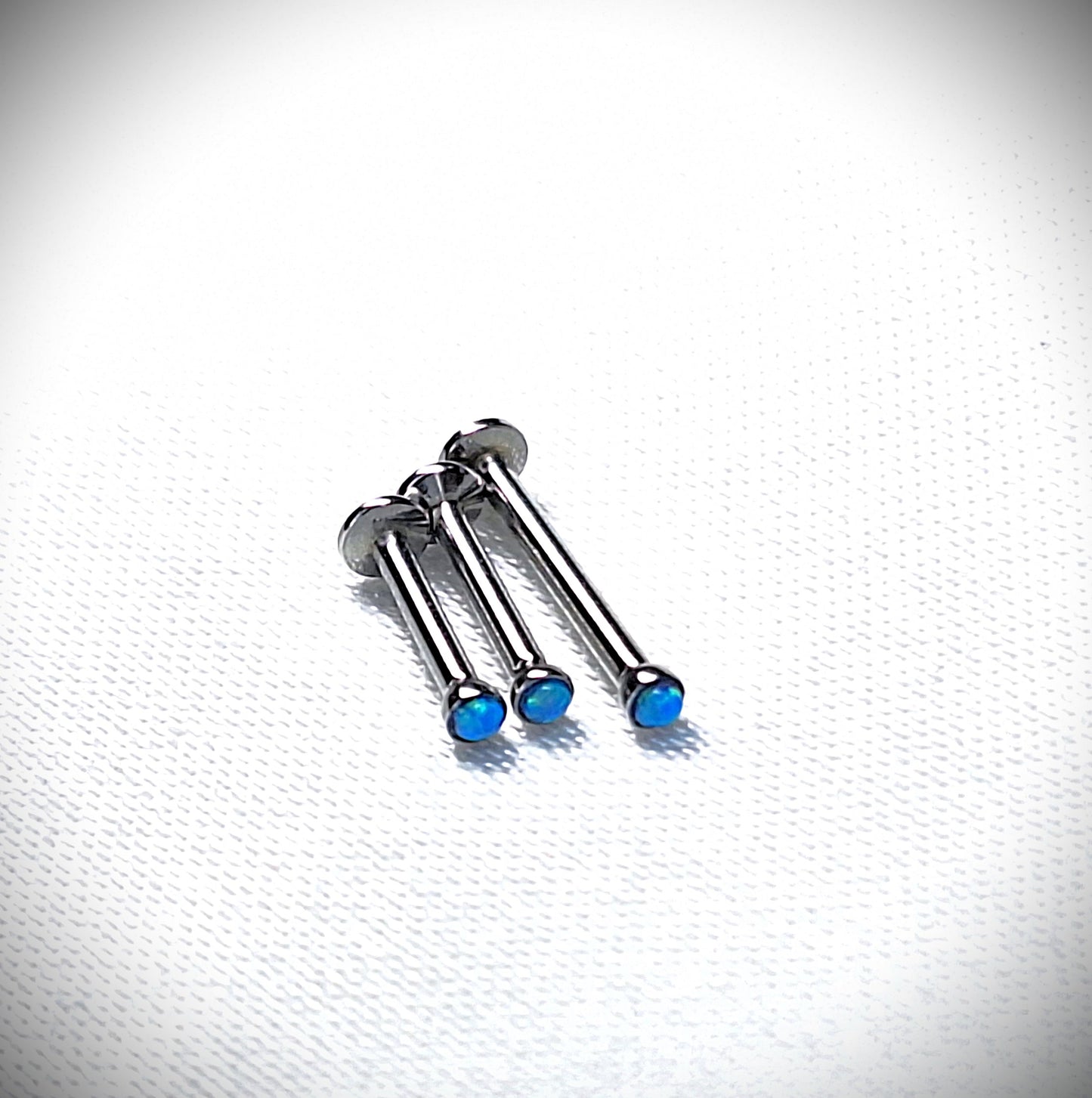 Push in Flat Backed stud with BLUE 2mm or 3mm Opal stone. 5mm, 6mm, 7mm, 8mm, 9mm, 10mm, 11mm, 12mm, 20ga, 18ga, 16ga