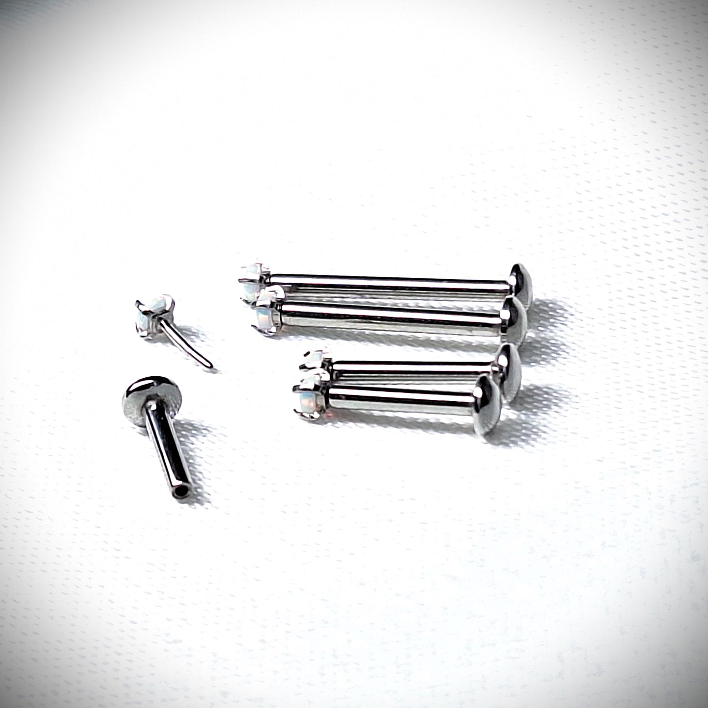 Push in Flat Backed stud with Prong Set WHITE 2mm or 3mm Opal stone. 5mm, 6mm, 7mm, 8mm, 9mm, 10mm, 11mm, 12mm, 20ga, 18ga, 16ga